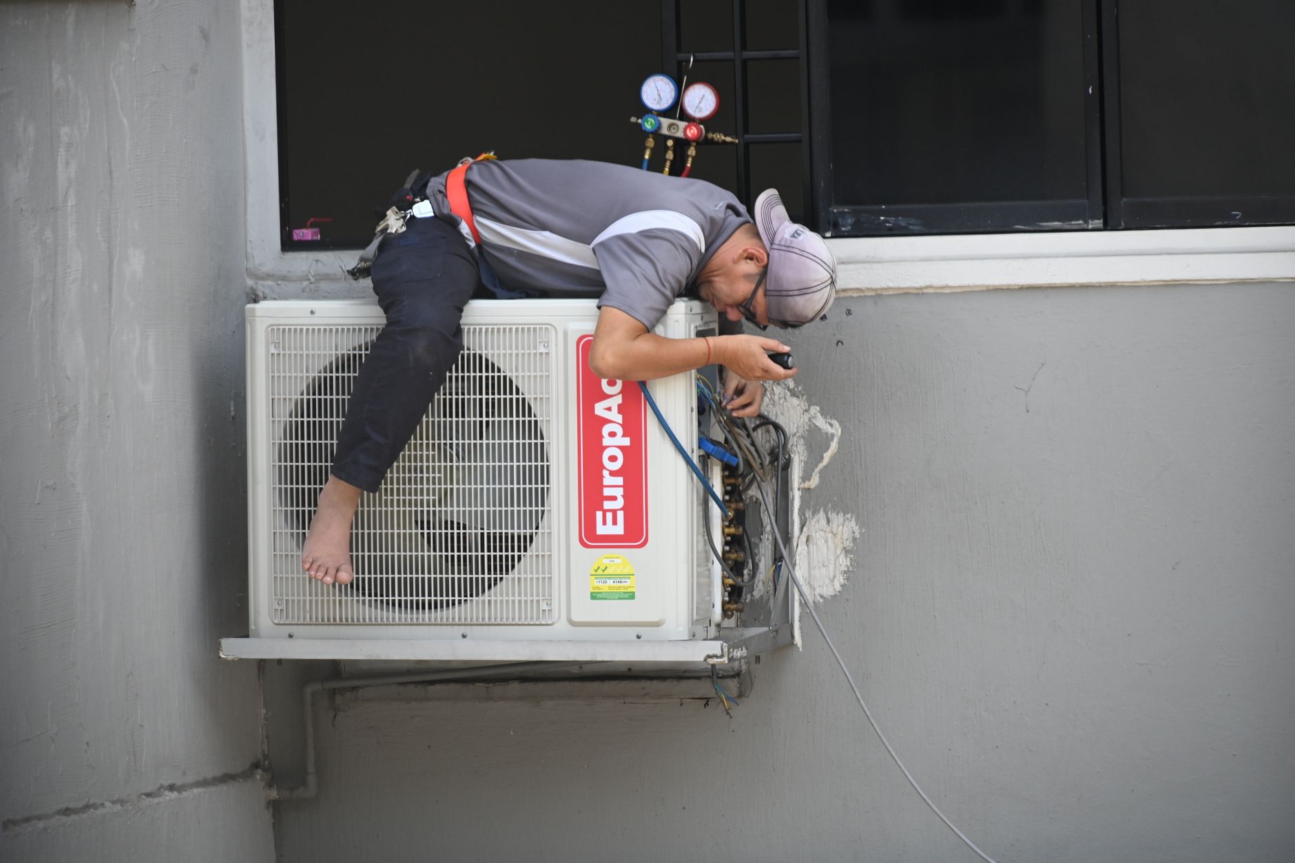 HVAC technician performing maintenance in Fayetteville, NC